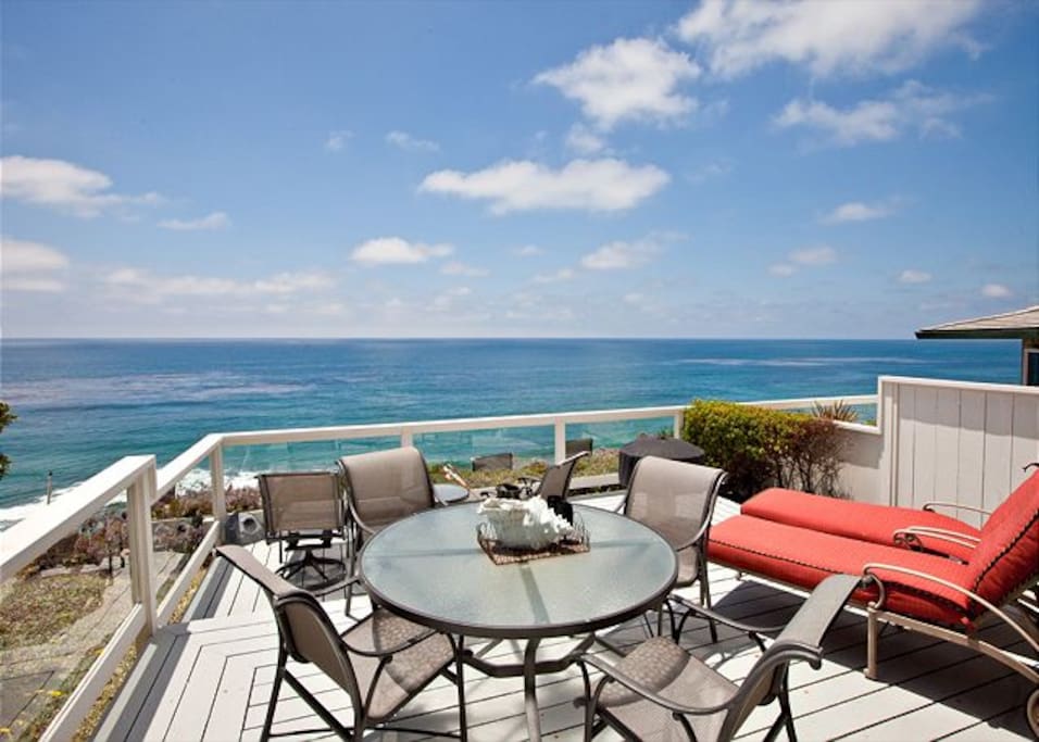 Oceanfront Deck With Grill and Patio Furniture.