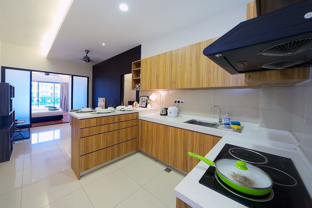 Kitchen with exhaust and dining area.