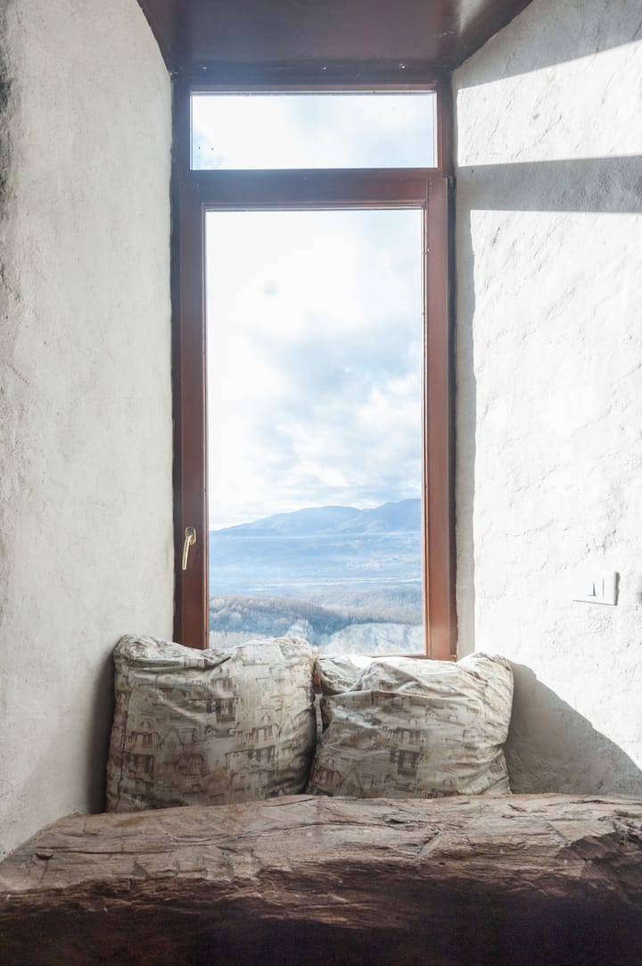 Window frames overlooking the Lunigiana valley
