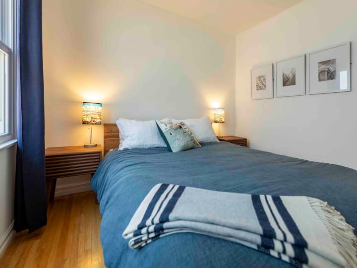 The Third Bedroom is in between the primary and the Secondary Bedroom, complete with a queen size bed and looks out onto the garden on the side of the house. 