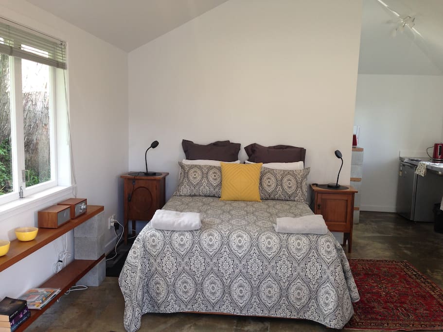 The main room has a queen sized bed.