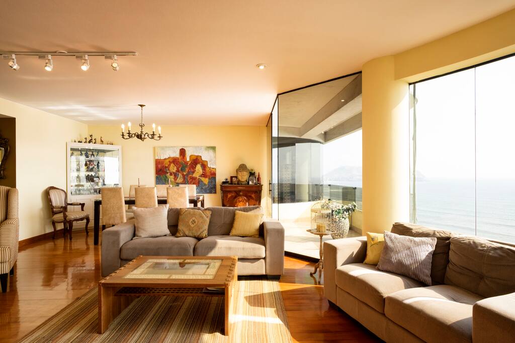 Open living room + dining room with great light and view