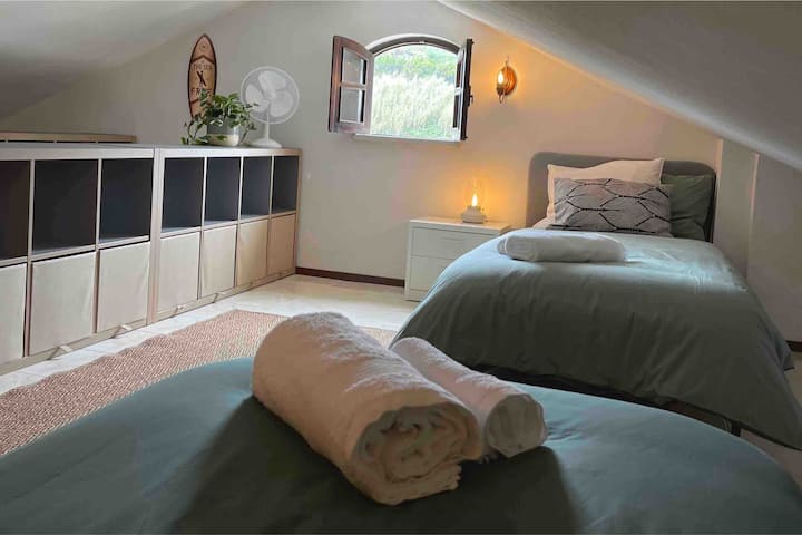 2  seperate beds upstairs, storage space for clothes, a toilet and a sink. 