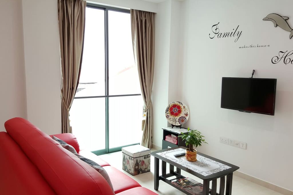 The living room is decorated with 'FAMILY' theme in mind.