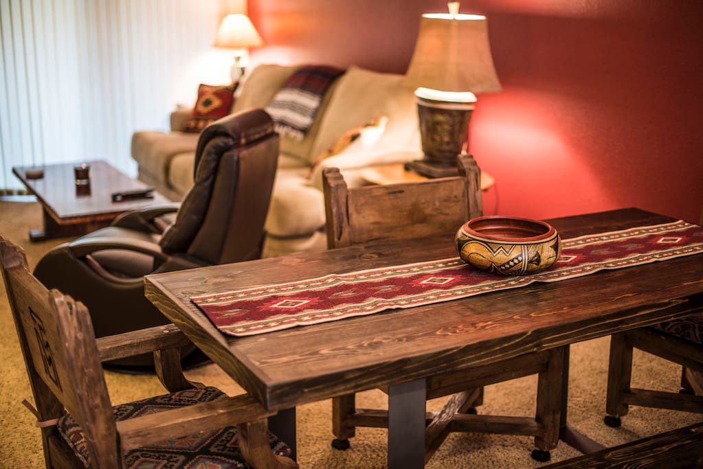Brand new custom made dining room table with antique chairs that came from Thunder Mountain Ranch. One of the first ranches in Sedona.