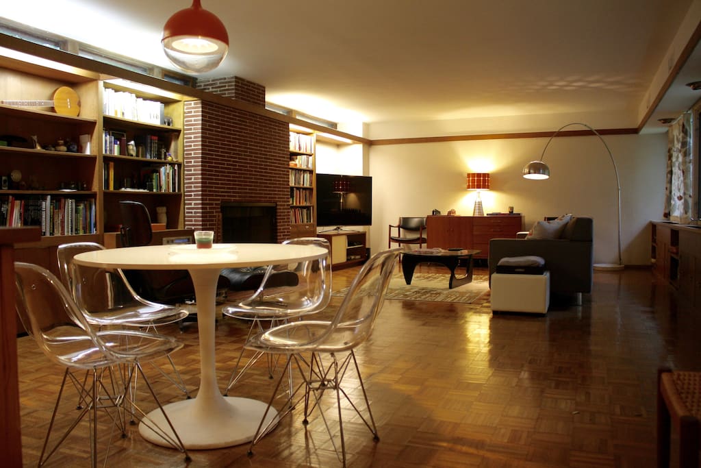 Open living and dining room with entertainment center.