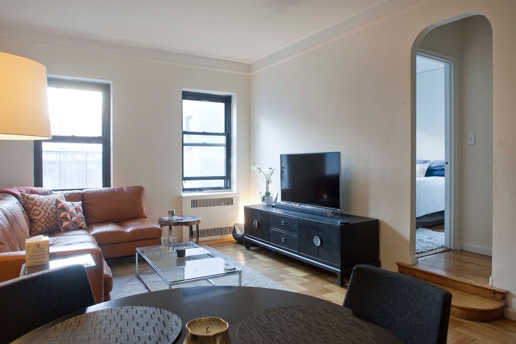 Living Room with comfortable leather couch and new 50" TV- High Dynamic Range