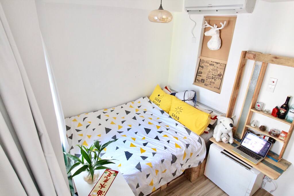 Cozy queen size bed facing harbor