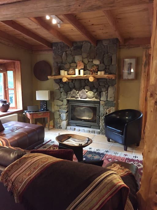 Living room with wood burning fireplace