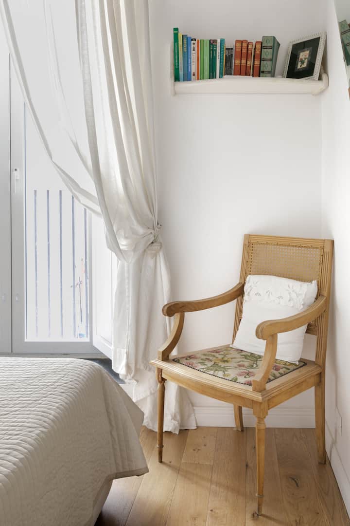 The old wooden chair in the room comes alive after an exquisite restoration.