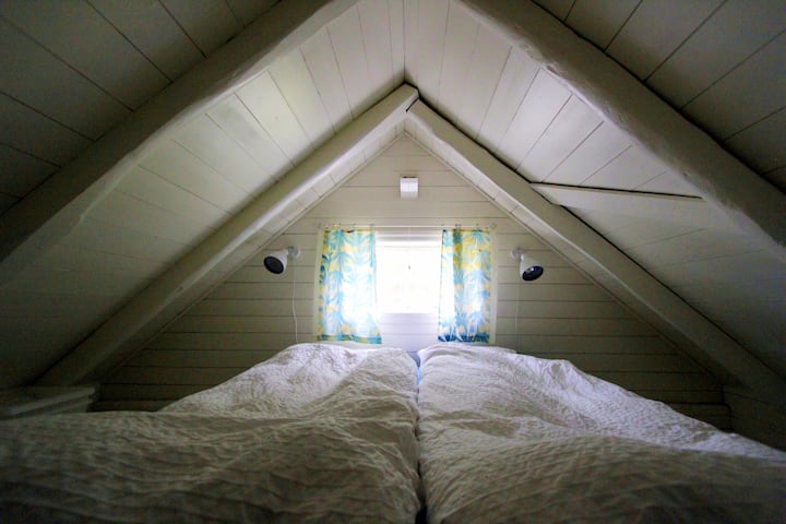 The compact bedroom on the loft.