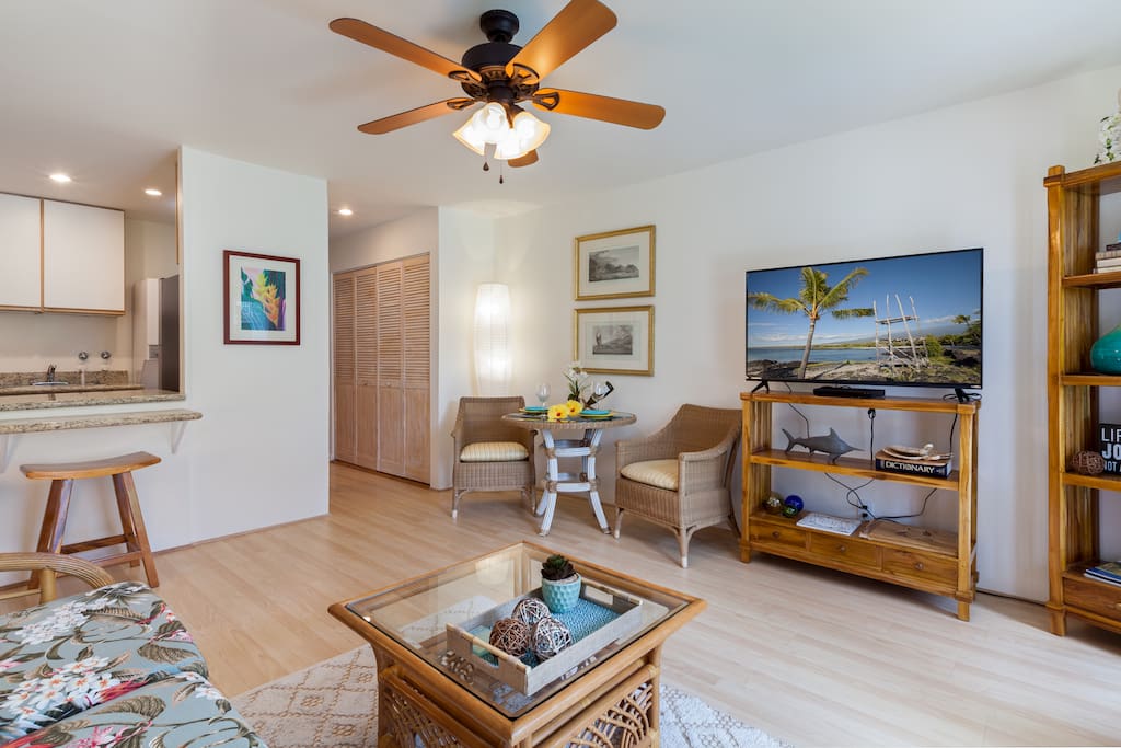 Dining room and entertainment center, with a peek at the kitchen.