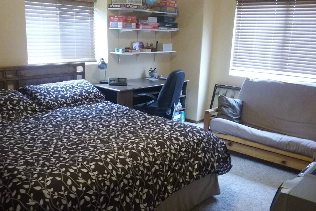 King size bed with desk and futon.