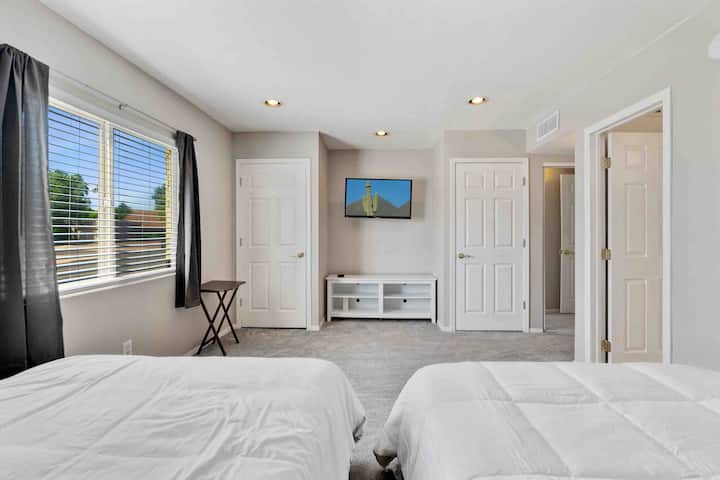 2 full beds with 2 closets and a 55 inch ROKU smart TV