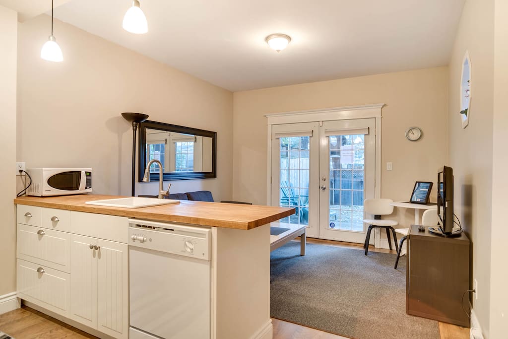 The French doors open up to a private patio where you can relax after a day of shopping, a visit to the theatre, a game, or a hard day of work.