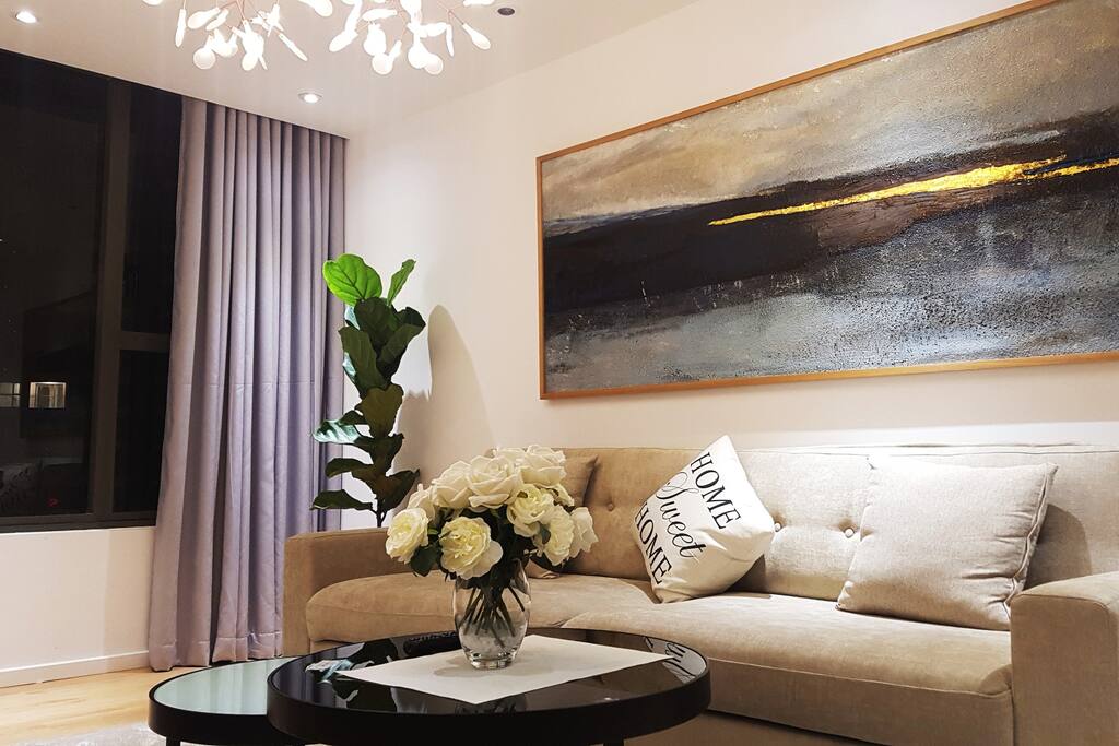 Another view of living room with a soft couch.