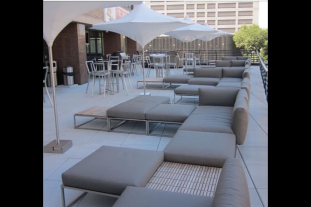 3rd floor outdoor patio with grill and vending machines.