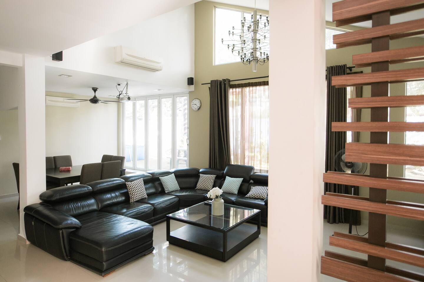 A spacious lounge greets guests as they enter into our house