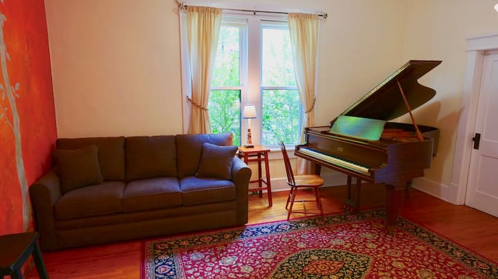 This secondary living room is truly a music room as the stunning grand piano takes center stage.  This room does close off from the main hallway if come of your group needs a quiet space to land.