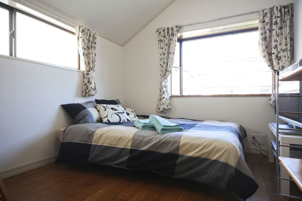 Full size bed with linen. Bright windows with blackout curtains.