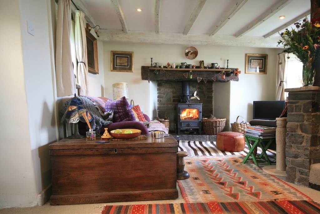 The lounge is heated by a wood burning stove and decorated with collections from my travels.