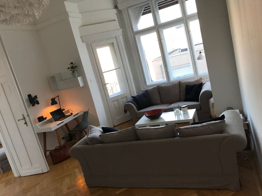 Living and dining room with cosy couches - perfect to what’s the illuminated castle at nights