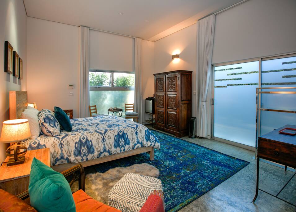 A queen-size bed awaits in the center of this studio