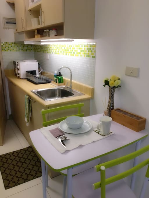 Dining area and kitchenette with brand-new appliances