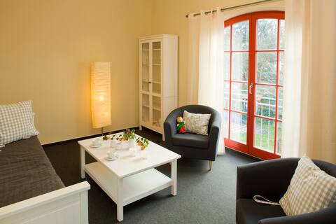 Top performing Airbnb: Suite 216. Bedroom and living room in Fürstenberg/Havel