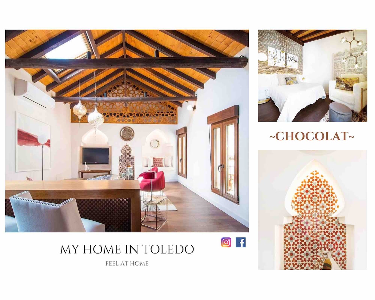 A spacious living area is featured with a high, sloped ceiling showcasing original wooden beams. Decorative elements include intricate mudejar arches and a handmade Zellige rug. Comfortable seating options invite relaxation, with natural light illuminating the room from large windows.