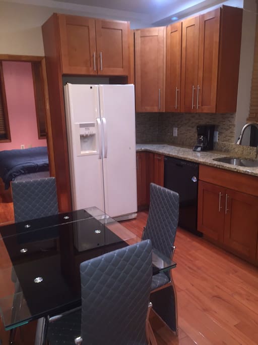 Gourmet kitchen with dishwasher
table and chairs