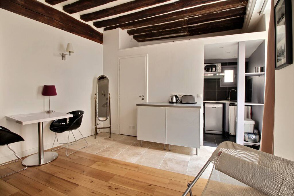 Living room with large double bed and TV
