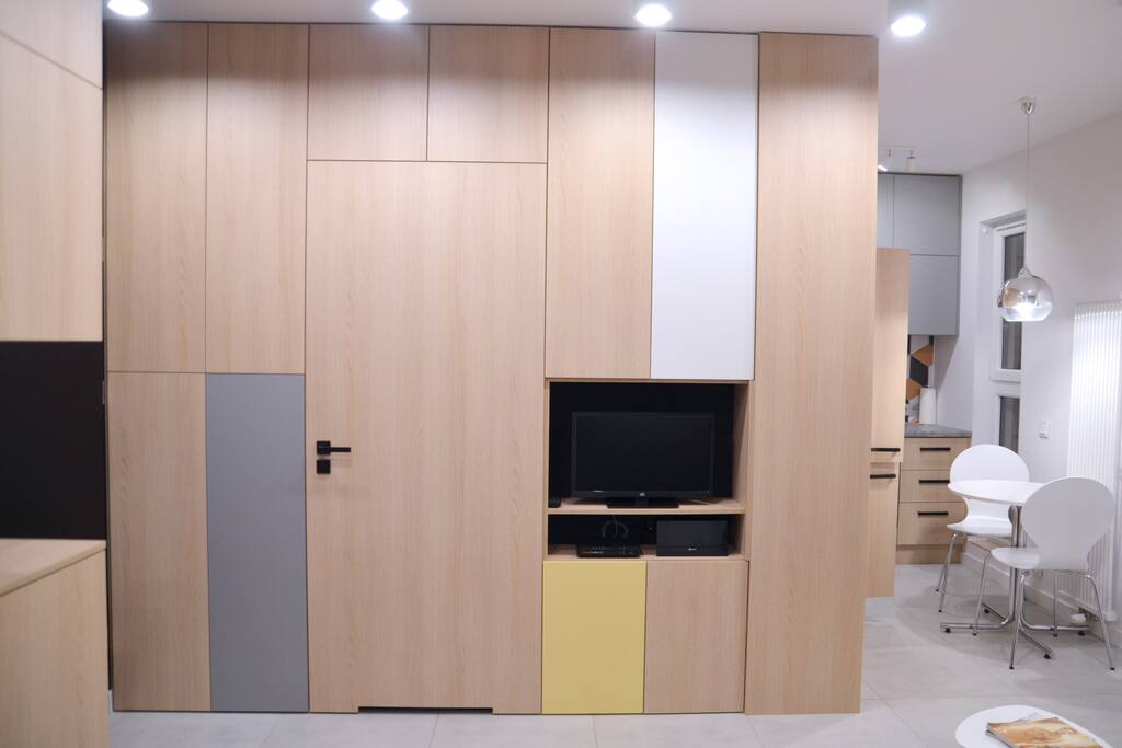 Living room with kitchen & ROKU TV