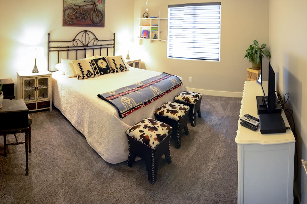 Master bedroom with cable tv and great view of the garden and vermillion cliffs!