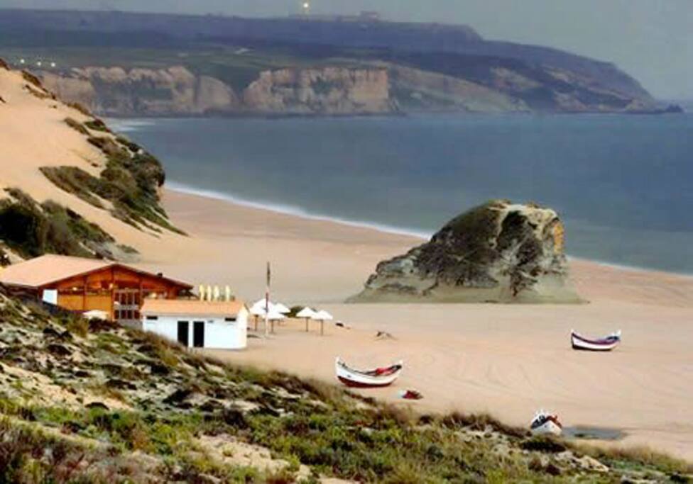 Meco beach with its beach bars and golden sand