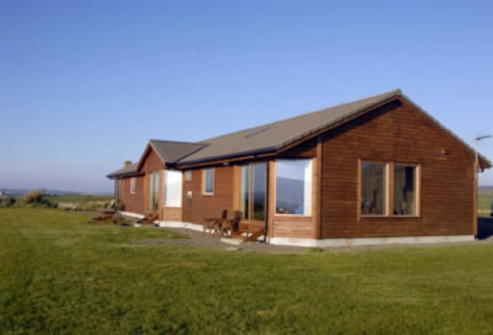 Back view of the chalets. Large picture glass windows look out to Scapa Flow
