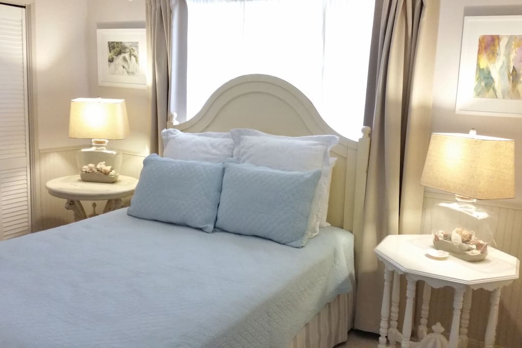 New decor with summer linens on the Euro Pillow Top queen size bed with blackout drapes for a restful night's sleep.