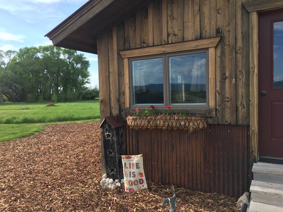 Flower baskets adorn the entrance in the summer.