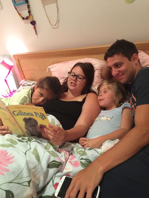 Our Help Exchange couple reading the kids a bed time story.