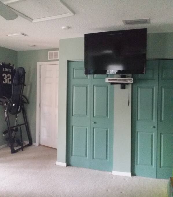 flat screen tv. with large closet space.