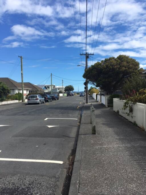 The street with the beach at the end.