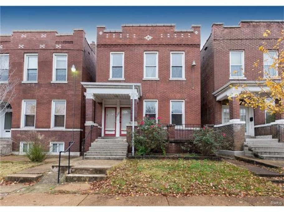 The Zen Nest occupies the upper unit of this charming and classic St. Louis brick home.