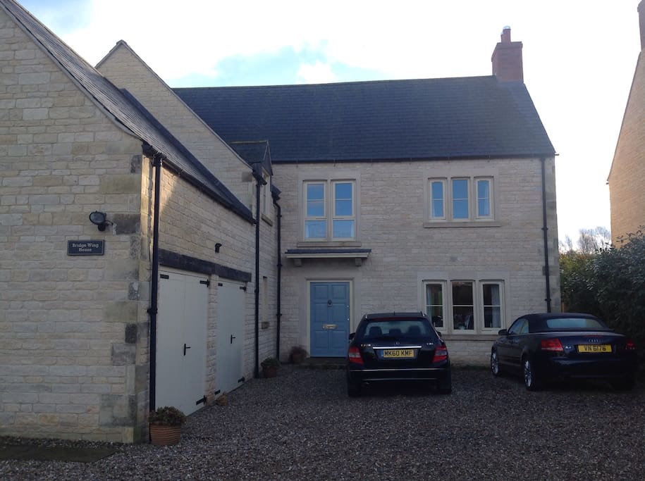 Look out for the sign on the end of the garage and the blue front door!