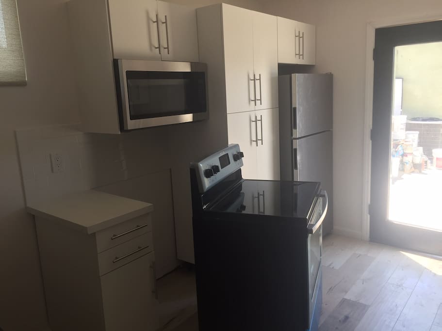 Almost finished Kitchen with Full size appliances, all Brand New, stainless, and lots of storage in the Kitchen cabinets