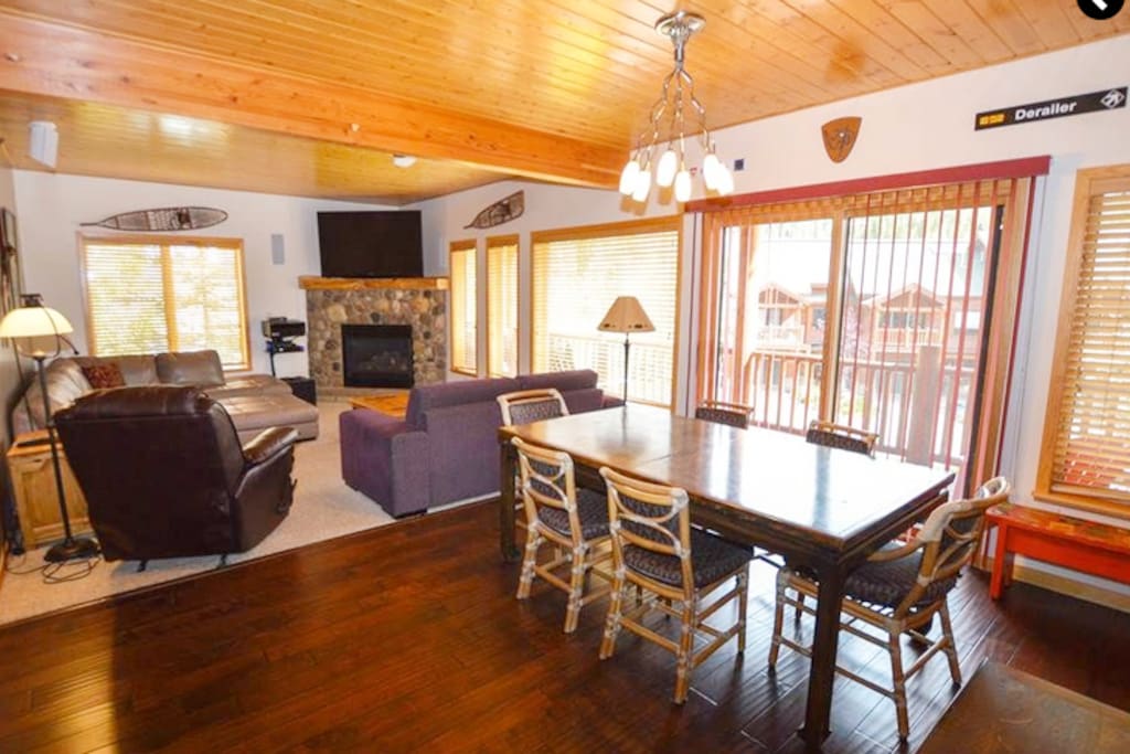 Open floor plan with tongue & groove wood ceiling & wood floor in entry & kitchen