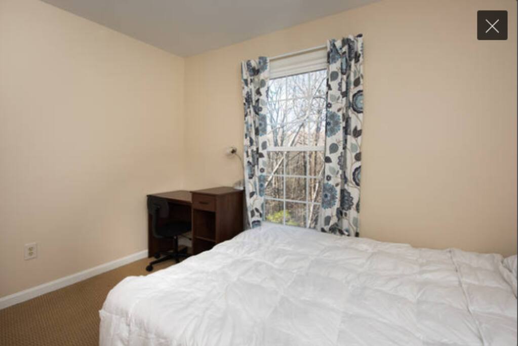 Another view of the cozy room, with the desk and lamp.