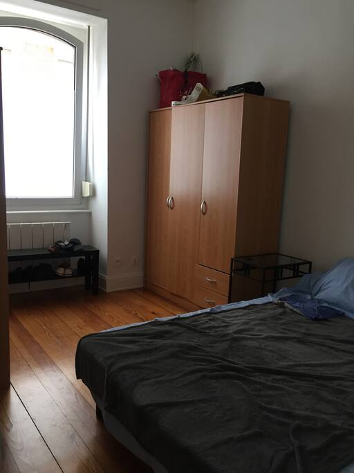 Well lit room with double bed