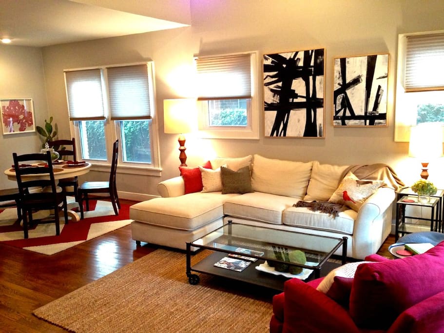 Bright and spacious living area. The comfortable sofa faces a 70-inch HDTV.