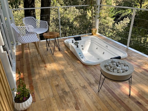 Container in the forest, jacuzzi, campfire