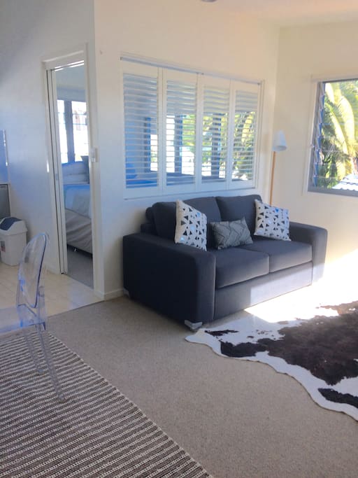 Recently freshly painted and restyled! Lounge area. 2nd Bedroom in background.